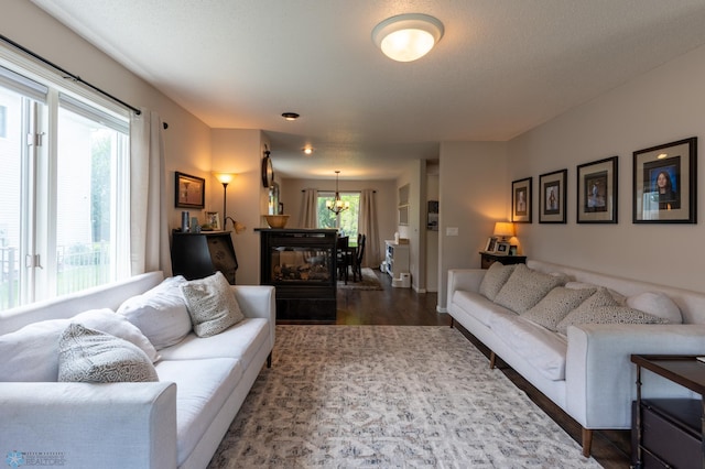 4408 Riverwood Dr N, Fargo, ND 58102 - living room featuring dark wood-type flooring and a chandelier