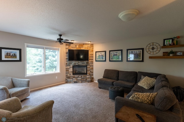 4408 Riverwood Dr N, Fargo, ND 58102 - living area with carpet, a fireplace, ceiling fan, baseboards, and a textured ceiling