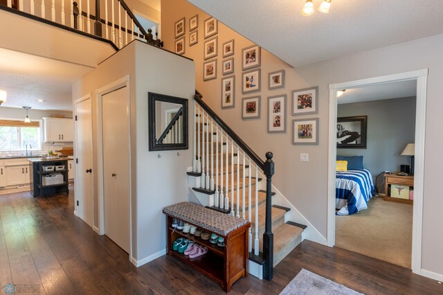 4408 Riverwood Dr N, Fargo, ND 58102 - staircase featuring wood finished floors and baseboards
