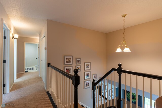 4408 Riverwood Dr N, Fargo, ND 58102 - corridor with an upstairs landing, carpet flooring, and baseboards