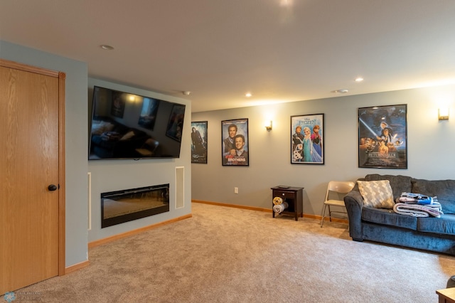 4408 Riverwood Dr N, Fargo, ND 58102 - living area with carpet floors, baseboards, a glass covered fireplace, and recessed lighting