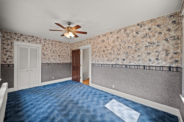 2059 Iglehart Ave, Saint Paul, MN 55104 - unfurnished bedroom with a closet, a ceiling fan, carpet floors, wallpapered walls, and baseboards