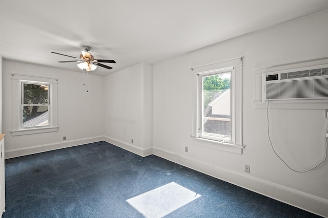 2059 Iglehart Ave, Saint Paul, MN 55104 - spare room featuring dark colored carpet, a ceiling fan, a wall mounted air conditioner, and baseboards