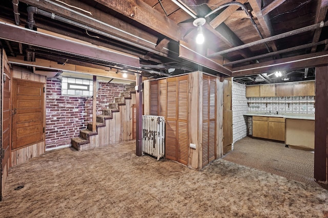 2059 Iglehart Ave, Saint Paul, MN 55104 - basement featuring carpet, a sink, brick wall, and stairs