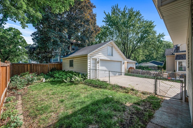 2059 Iglehart Ave, Saint Paul, MN 55104 - view of yard featuring a detached garage and an outbuilding
