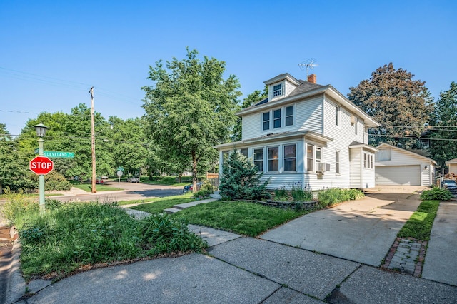 2059 Iglehart Ave, Saint Paul, MN 55104 - american foursquare style home with an outdoor structure, a detached garage, a chimney, and cooling unit