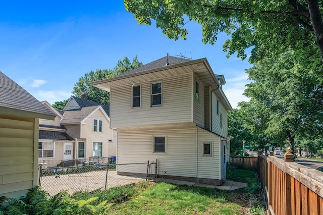 2059 Iglehart Ave, Saint Paul, MN 55104 - rear view of house with a fenced backyard