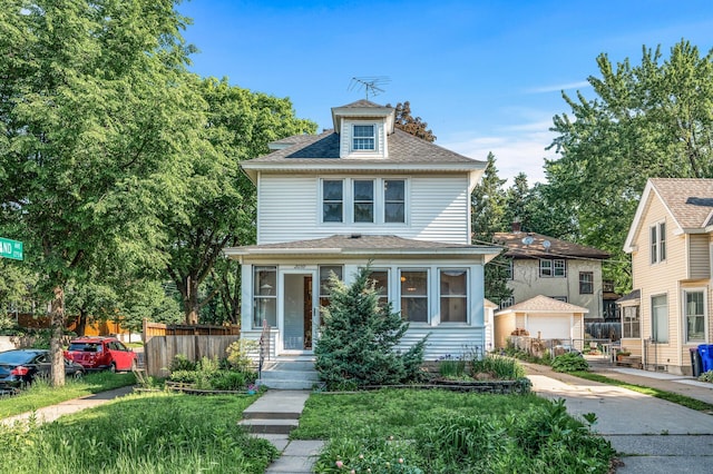 2059 Iglehart Ave, Saint Paul, MN 55104 - traditional style home featuring an outbuilding, a shingled roof, and driveway