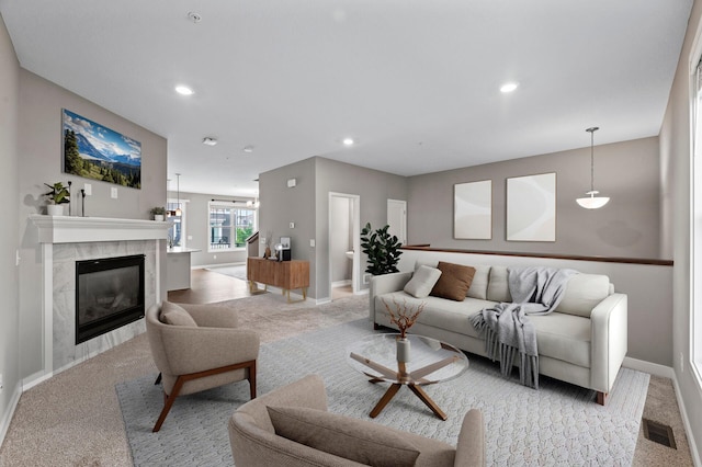 5040 93rd Ln N, Brooklyn Park, MN 55443 - living room with light carpet, baseboards, a fireplace, and recessed lighting
