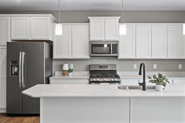 5040 93rd Ln N, Brooklyn Park, MN 55443 - kitchen with appliances with stainless steel finishes, white cabinetry, and pendant lighting