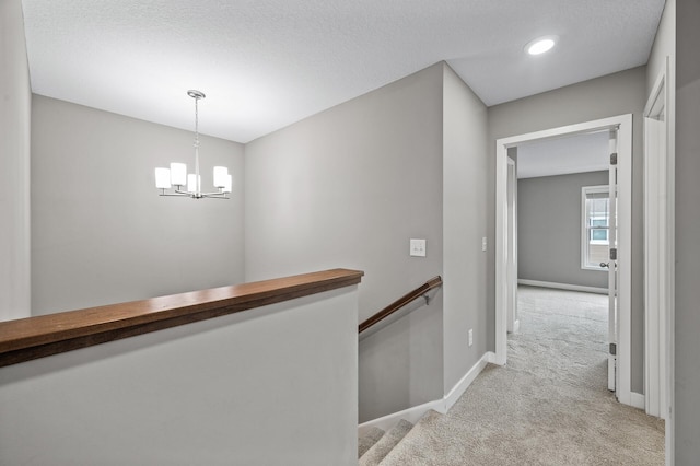 5040 93rd Ln N, Brooklyn Park, MN 55443 - hallway with carpet flooring, baseboards, a chandelier, an upstairs landing, and recessed lighting