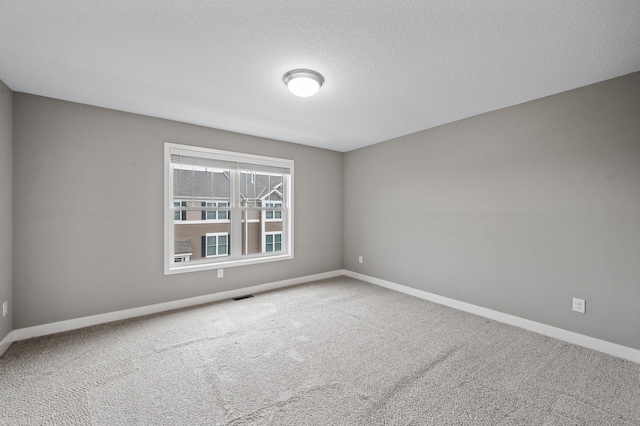5040 93rd Ln N, Brooklyn Park, MN 55443 - carpeted spare room featuring baseboards and a textured ceiling
