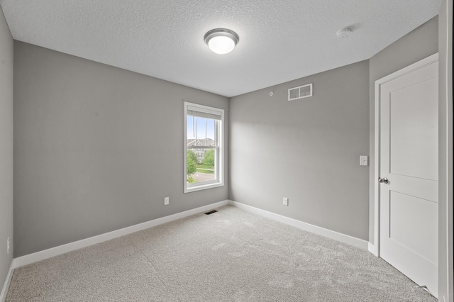 5040 93rd Ln N, Brooklyn Park, MN 55443 - carpeted empty room featuring a textured ceiling, baseboards, and a smoke detector