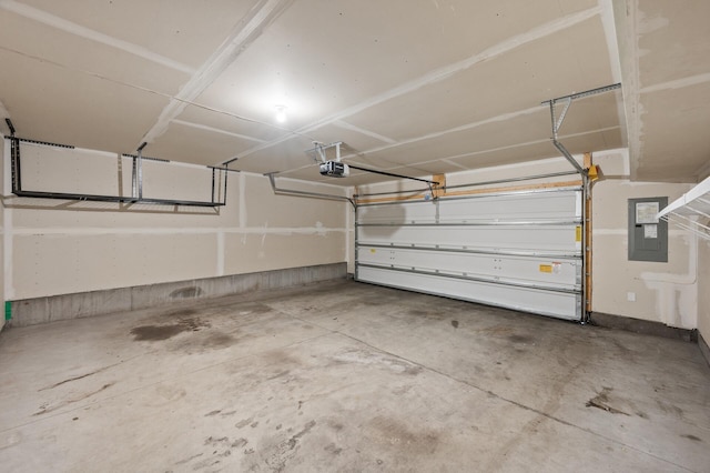5040 93rd Ln N, Brooklyn Park, MN 55443 - garage featuring electric panel and a garage door opener