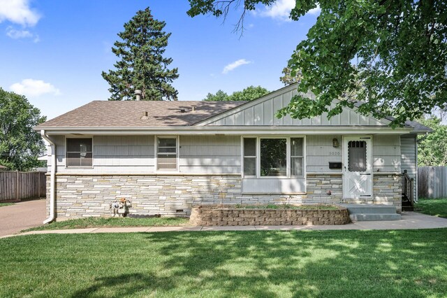 5030 Jefferson St NE, Columbia Heights, MN 55421 - view of front of property featuring stone siding and roof with shingles