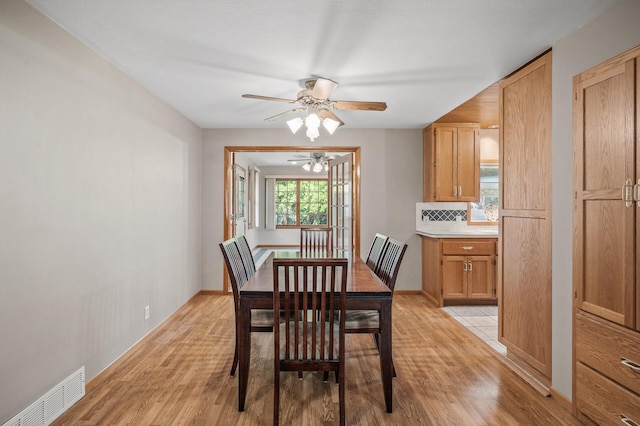 5030 Jefferson St NE, Columbia Heights, MN 55421 - dining room with a ceiling fan, light wood-style flooring, and baseboards