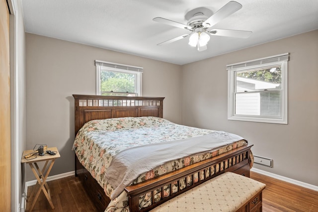 5030 Jefferson St NE, Columbia Heights, MN 55421 - bedroom featuring baseboards, wood finished floors, and ceiling fan