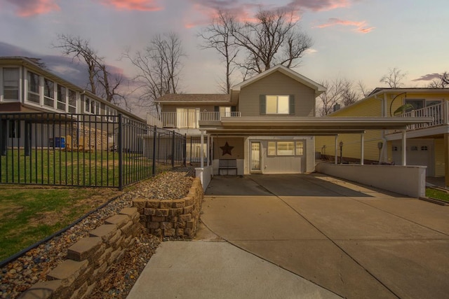 18023 Roberds Lake Blvd, Faribault, MN 55021 - view of front facade featuring a balcony, a carport, and driveway