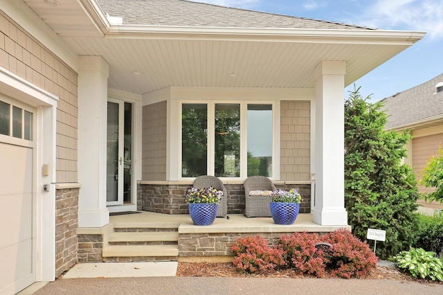 2524 Sandstone Ln, Orono, MN 55356 - doorway to property with covered porch, roof with shingles, and stone siding