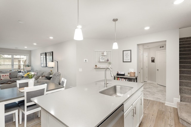1212 Lower 143rd St E, Rosemount, MN 55068 - kitchen with a sink, white cabinetry, recessed lighting, pendant lighting, and light countertops