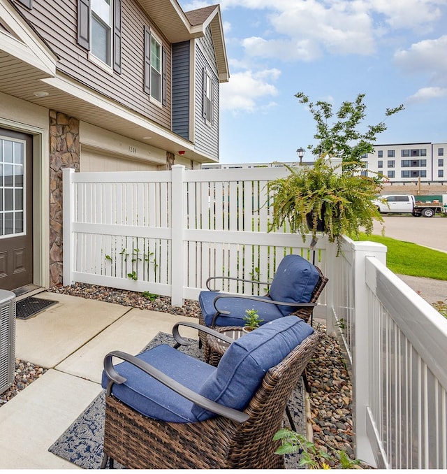 1212 Lower 143rd St E, Rosemount, MN 55068 - view of patio with an attached garage