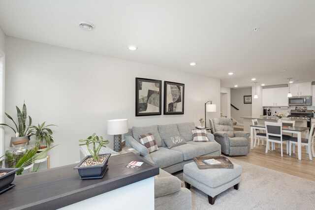 1212 Lower 143rd St E, Rosemount, MN 55068 - living area with recessed lighting, stairway, and light wood-type flooring
