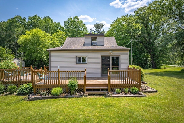 16957 Lake Netta Dr NE, Ham Lake, MN 55304 - back of property featuring a yard, a wooden deck, roof with shingles, and view of wooded area