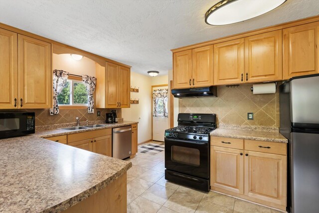 16957 Lake Netta Dr NE, Ham Lake, MN 55304 - kitchen featuring black appliances, under cabinet range hood, a sink, decorative backsplash, and light brown cabinetry