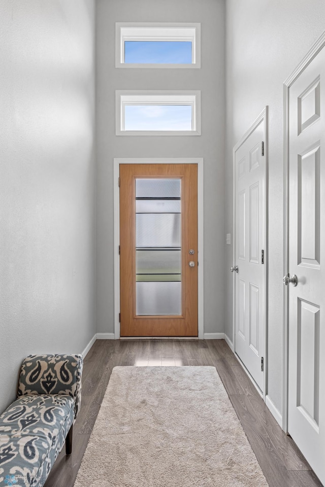 1546 68th Ave S, Fargo, ND 58104 - entrance foyer with a high ceiling, baseboards, and wood finished floors