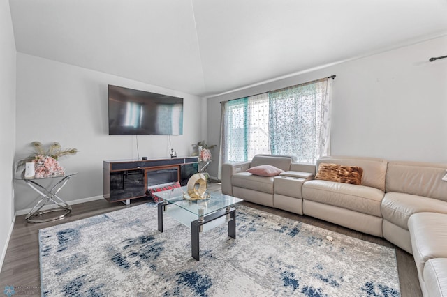 1546 68th Ave S, Fargo, ND 58104 - living area with wood finished floors, baseboards, and vaulted ceiling