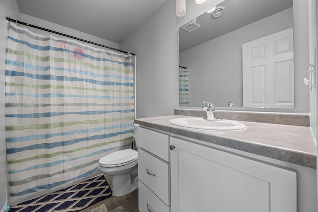 1546 68th Ave S, Fargo, ND 58104 - full bath with vanity, toilet, wood finished floors, and curtained shower