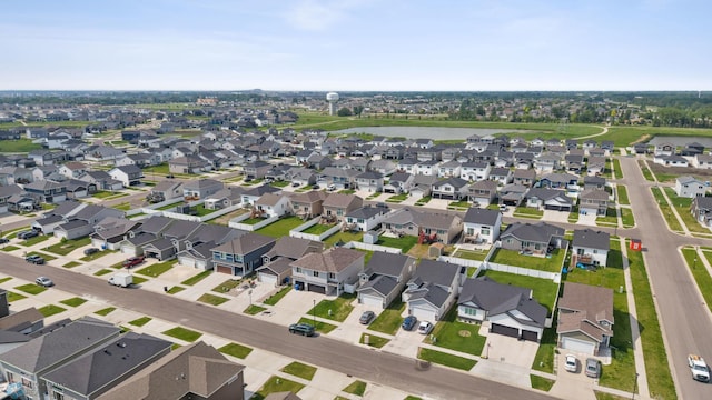 1546 68th Ave S, Fargo, ND 58104 - aerial view of property and surrounding area with nearby suburban area and a large body of water