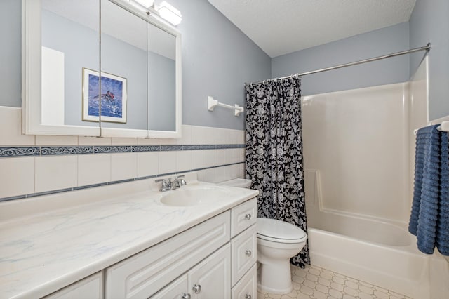 1198 Saint Clair Ave, Saint Paul, MN 55105 - full bathroom featuring vanity, toilet, shower / bathtub combination with curtain, wainscoting, and a textured ceiling