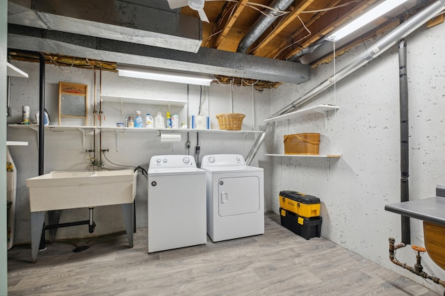 1198 Saint Clair Ave, Saint Paul, MN 55105 - laundry room featuring separate washer and dryer and wood finished floors