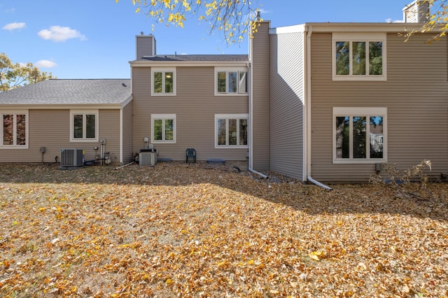 1198 Saint Clair Ave, Saint Paul, MN 55105 - back of house featuring a chimney and cooling unit