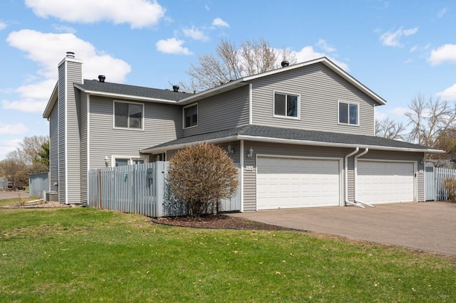 7674 Dunmore Rd, Woodbury, MN 55125 - view of side of property with a garage, a chimney, driveway, and a shingled roof