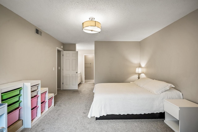 7510 Cahill Rd Unit 211B, Edina, MN 55439 - carpeted bedroom with a textured ceiling