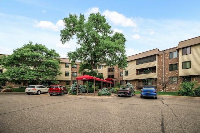 7510 Cahill Rd Unit 211B, Edina, MN 55439 - view of property with uncovered parking