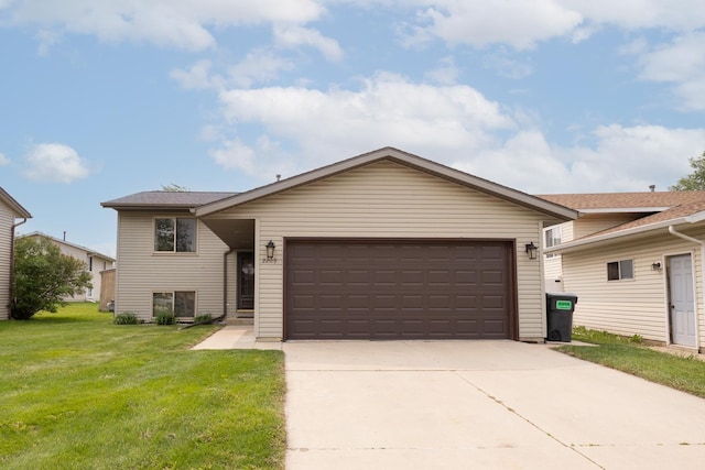 2209 18th Ave SE, Rochester, MN 55904 - split level home with an attached garage, a front lawn, and driveway