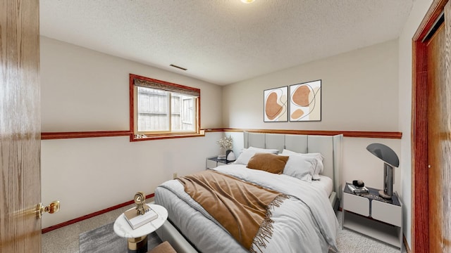 2209 18th Ave SE, Rochester, MN 55904 - bedroom featuring carpet flooring and a textured ceiling