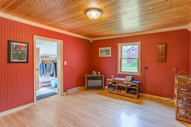 N8355 330th St, Gilman Twp, WI 54767 - sitting room featuring crown molding, hardwood / wood-style floors, wooden ceiling, heating unit, and baseboards