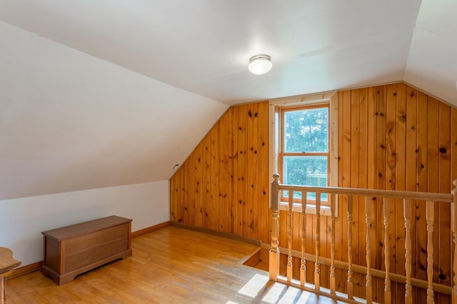 N8355 330th St, Gilman Twp, WI 54767 - bonus room featuring vaulted ceiling, wood finished floors, baseboards, and wood walls