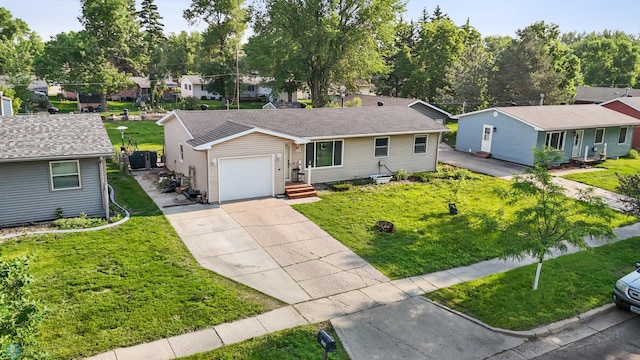 226 12th Ave W, West Fargo, ND 58078 - ranch-style home with concrete driveway, an attached garage, a front yard, and a residential view