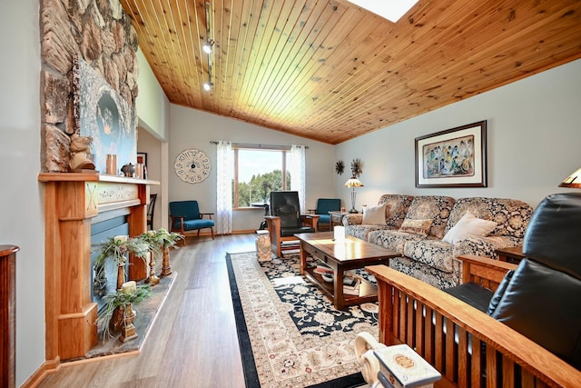 206 Skyline Hts, Wabasha, MN 55981 - living area featuring vaulted ceiling, wooden ceiling, a fireplace, wood finished floors, and baseboards