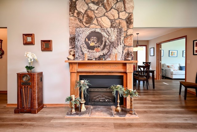 206 Skyline Hts, Wabasha, MN 55981 - living area with wood finished floors, baseboards, and a fireplace