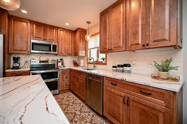 206 Skyline Hts, Wabasha, MN 55981 - kitchen featuring stainless steel appliances, a sink, brown cabinets, and recessed lighting