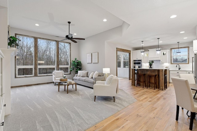 1843 Campfire Dr E, Waconia, MN 55387 - living area featuring healthy amount of natural light, recessed lighting, light wood-style flooring, and ceiling fan