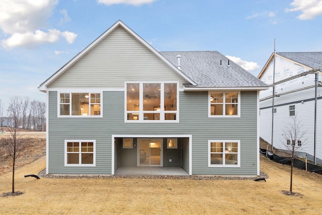 1843 Campfire Dr E, Waconia, MN 55387 - back of house featuring a patio, a yard, and roof with shingles