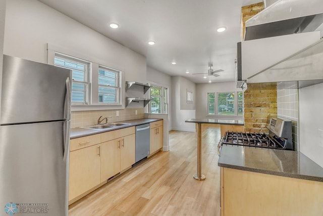 1036 12th St N, Fargo, ND 58102 - kitchen featuring appliances with stainless steel finishes, a sink, tasteful backsplash, ceiling fan, and recessed lighting