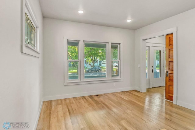 1036 12th St N, Fargo, ND 58102 - empty room with light wood-style floors, baseboards, and recessed lighting